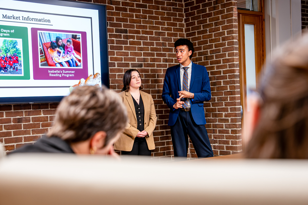 Students in the Applied Resource and Economics Club, a majority of whom major in the Department of Agricultural and Resource Economics (ARE) in the College of Agriculture, Health and Natural Resources (CAHNR), pitch ideas to Christian Heiden ‘20 (CAHNR), an ARE alum and founder of Levo International, a company designed to empower people and communities to end poverty, specializing in hydroponic farming to improve food security in the Homer Babbidge Library (HBL). Apr. 22, 2026.