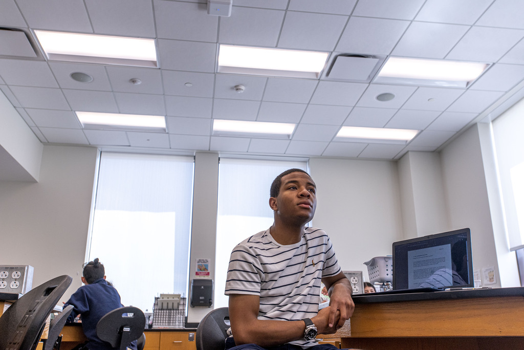 UConn Hartford student listening to a lecture in a classroom. April 13, 2022.